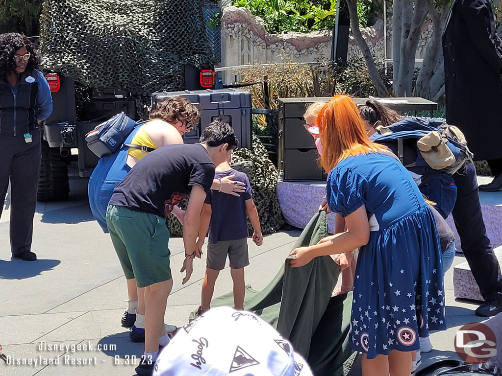 The session I was at featured Teamwork. So these guests were working to flip over the blanket without picking it up and the young guests till standing on it.