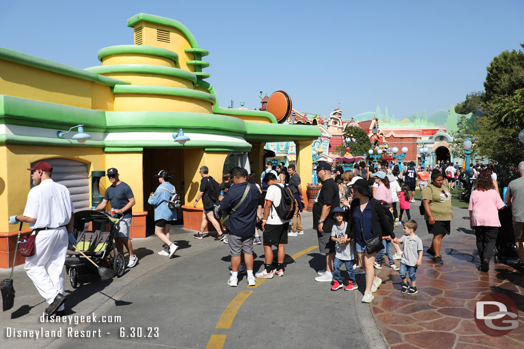 A line of guests for the drinking fountain.. blocking the walkway.