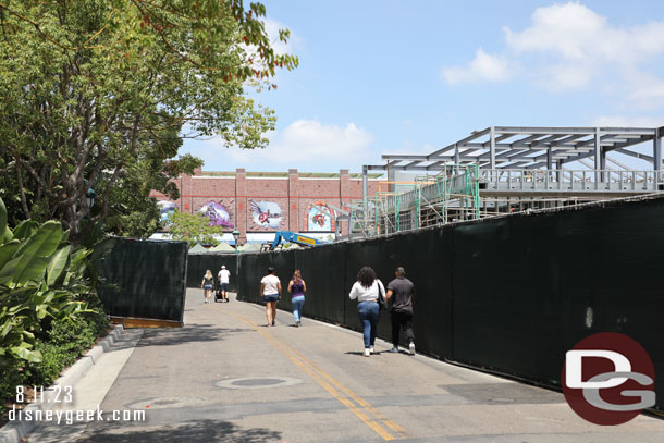 Fences on both sides of the walkway/street.  On the right is the steel for the new Din Tai Fung Restaurant.