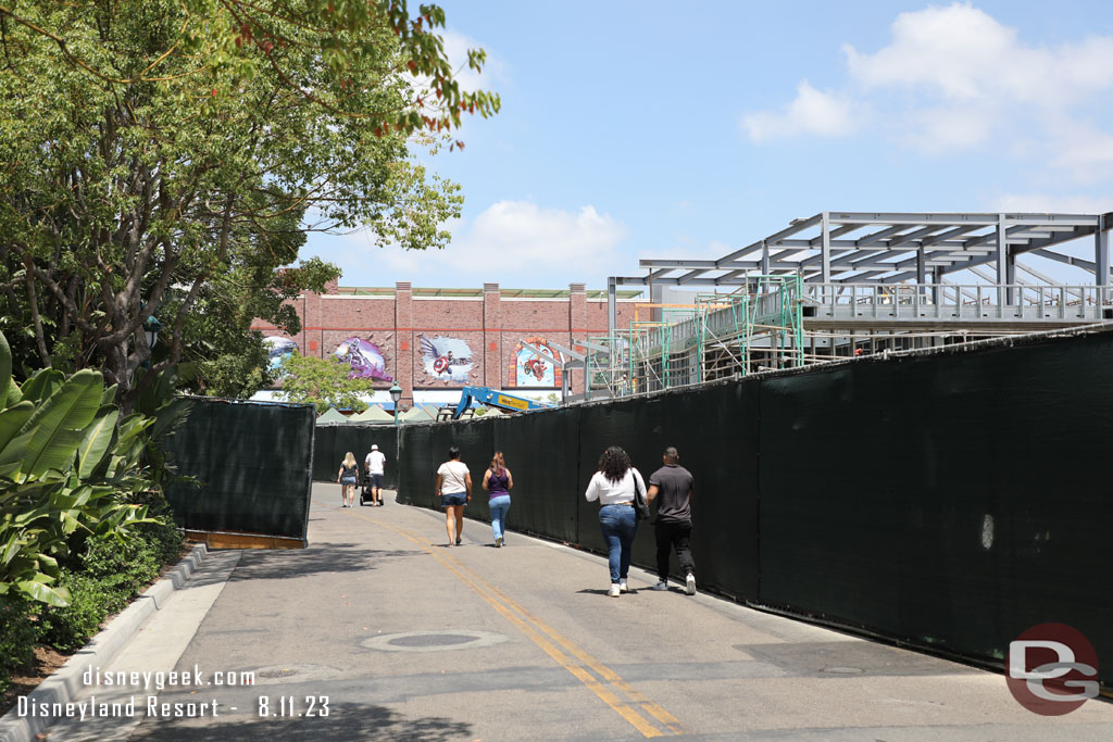 Fences on both sides of the walkway/street.  On the right is the steel for the new Din Tai Fung Restaurant.