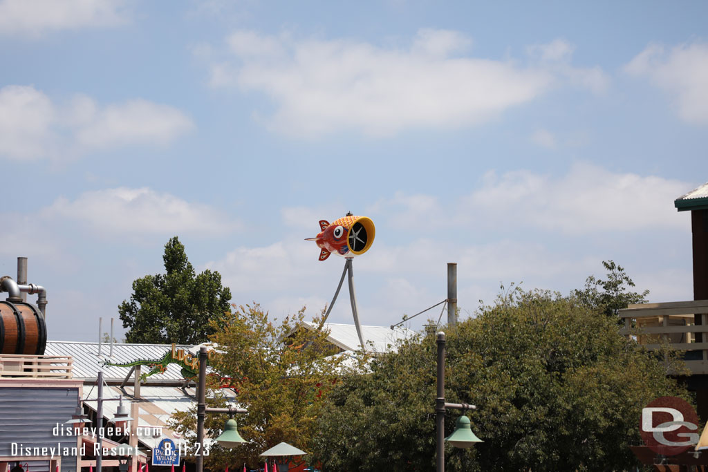 A wind turbine over the trees