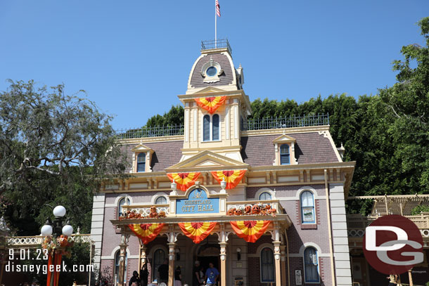 Main Street USA features its traditional orange bunting and carved pumpkins