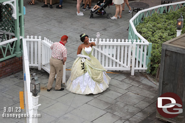 They held the boat for Tiana to board.