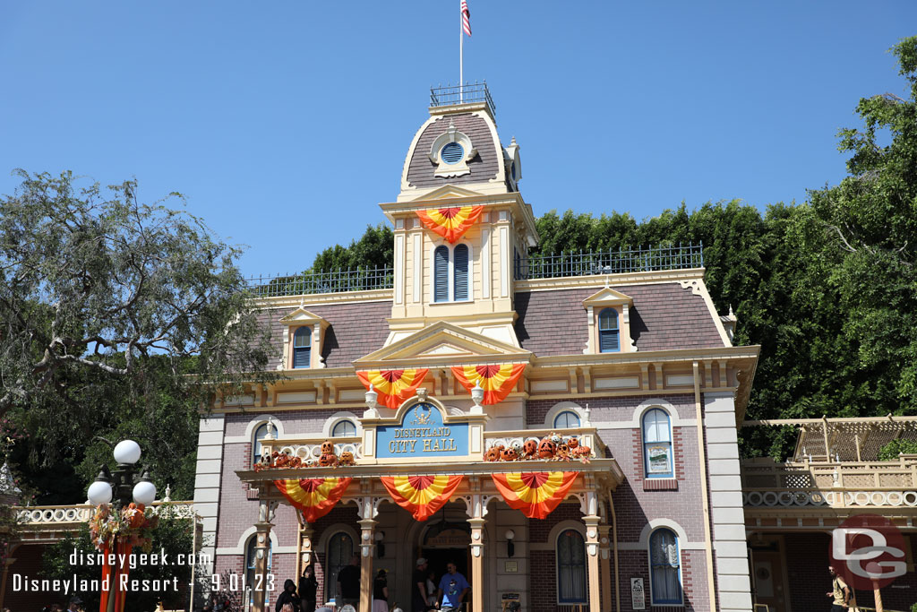 Main Street USA features its traditional orange bunting and carved pumpkins