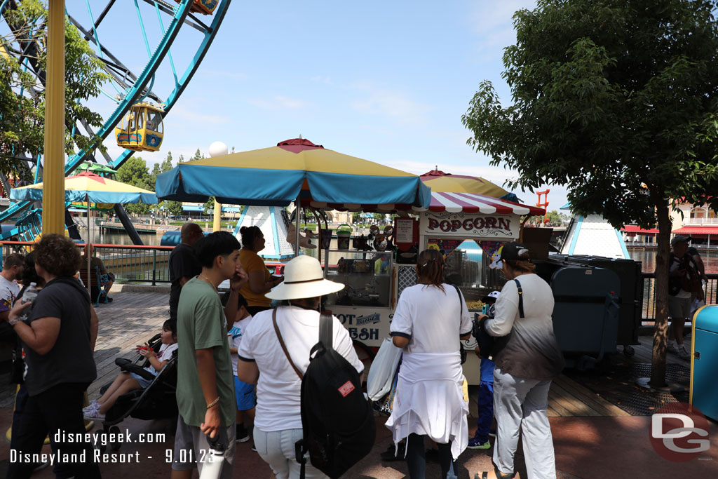 Only a few guests in line for popcorn buckets on Pixar Pier.