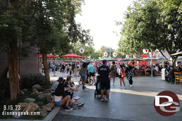 Guests hanging around waiting to get in line to meet Baymax