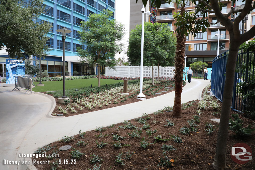 The fences are down and the new smaller lawn and walkway leading to the Discovery Tower is visible.