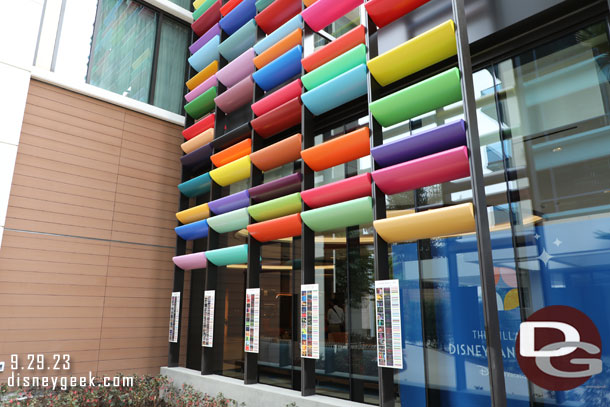 The colored panels on the facade of the tower are color maps for several films. There are plaques at the bottom of each. 