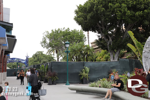 Fences still up for pavement work leading to the parking lots