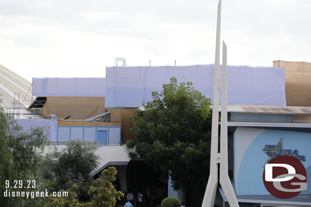 Scrims, scaffolding and walls up around Space Mountain and its queue space and other rooftops in the area.