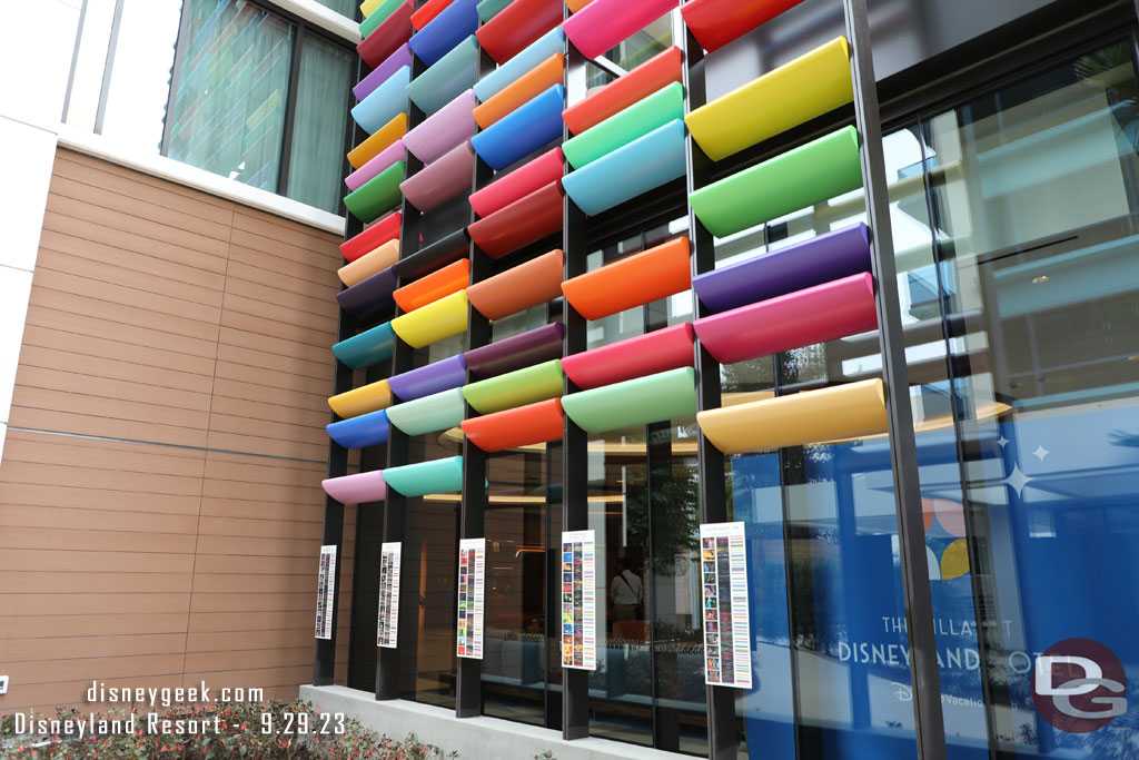 The colored panels on the facade of the tower are color maps for several films. There are plaques at the bottom of each. 