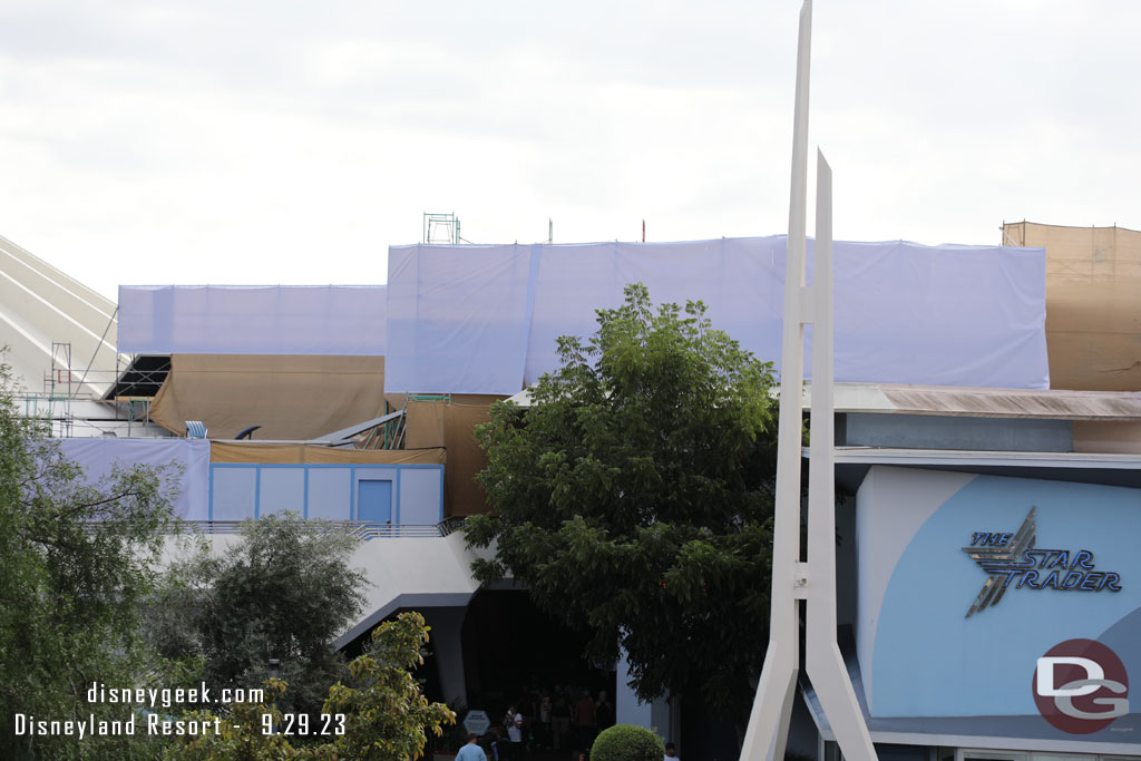 Scrims, scaffolding and walls up around Space Mountain and its queue space and other rooftops in the area.