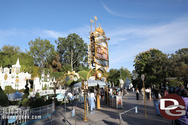 3:06pm - 5 min wait posted for it's a small world holiday at the moment, looks like it just reopened, and parade is distracting/blocking people finding their way out here