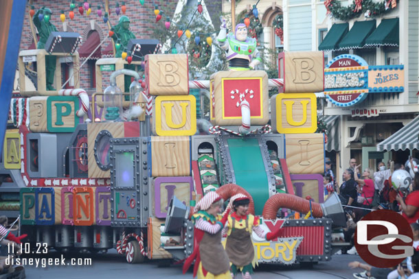 Buzz has lost his float, he now rides on the Toy Factory float