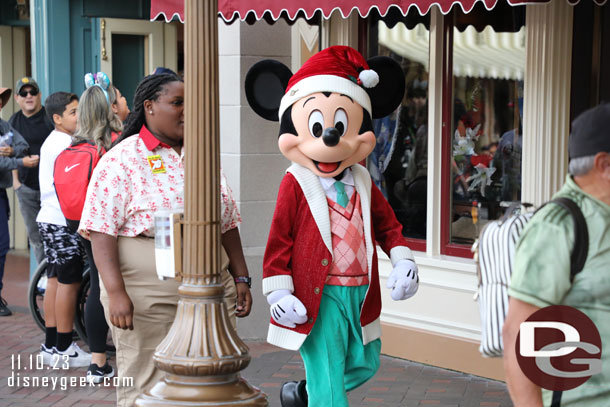 Mickey Mouse in his new holiday outfit on his way to meet guests.