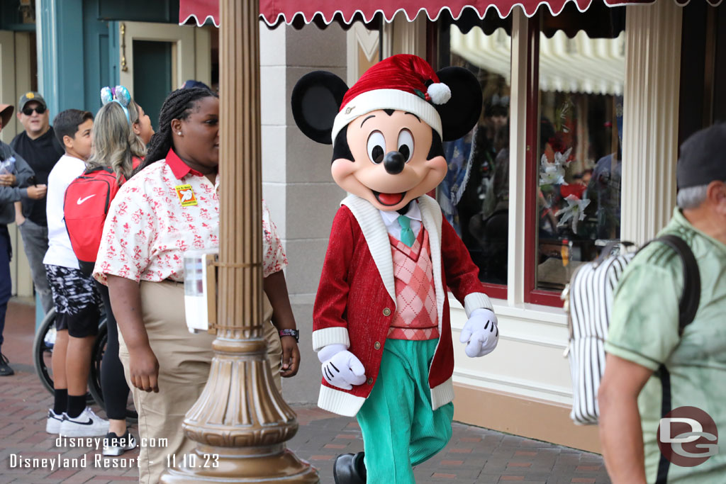 Mickey Mouse in his new holiday outfit on his way to meet guests.