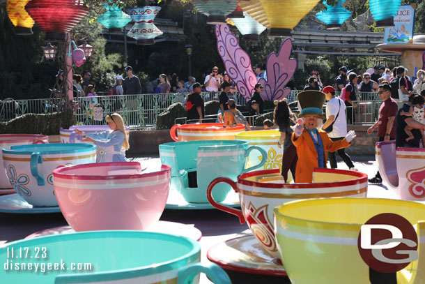 Alice and the Mad Hatter greeting guests at the tea cups as I walked by