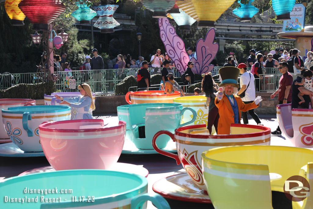 Alice and the Mad Hatter greeting guests at the tea cups as I walked by