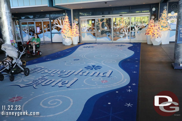 A new entrance carpet, trees and graphics on the windows and doors.