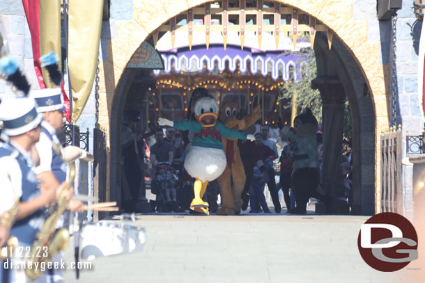 Donald leading the group through the Castle to join the Disneyland Band