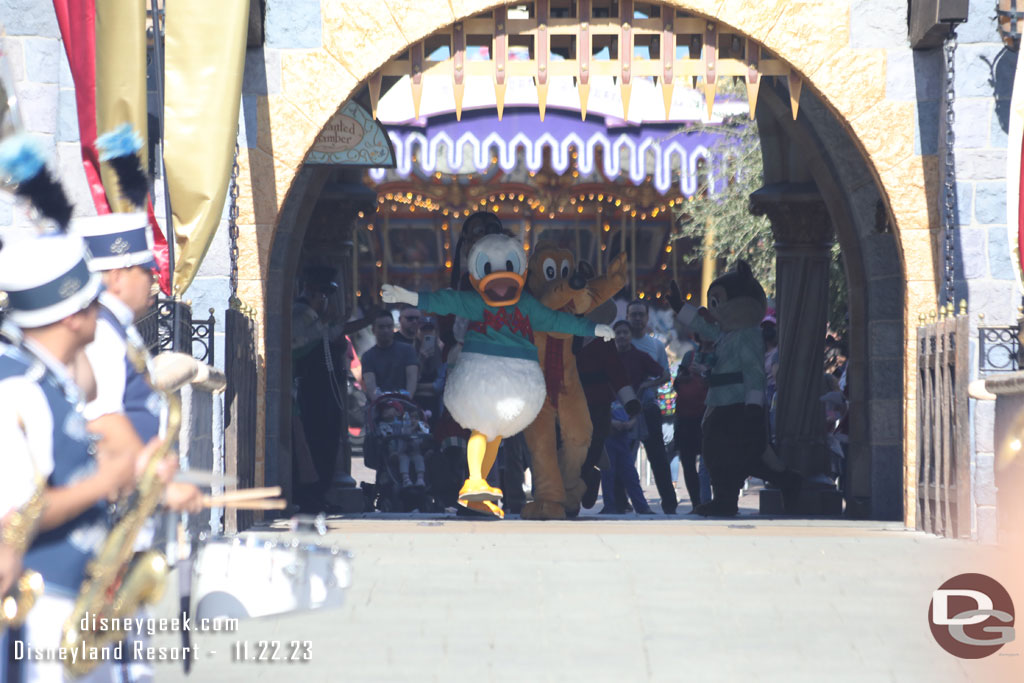 Donald leading the group through the Castle to join the Disneyland Band