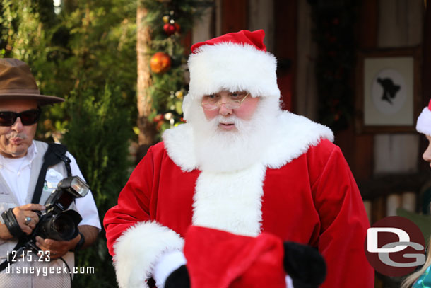 Santa was out his time by and he was visiting with those in the queue (and standing in the area)