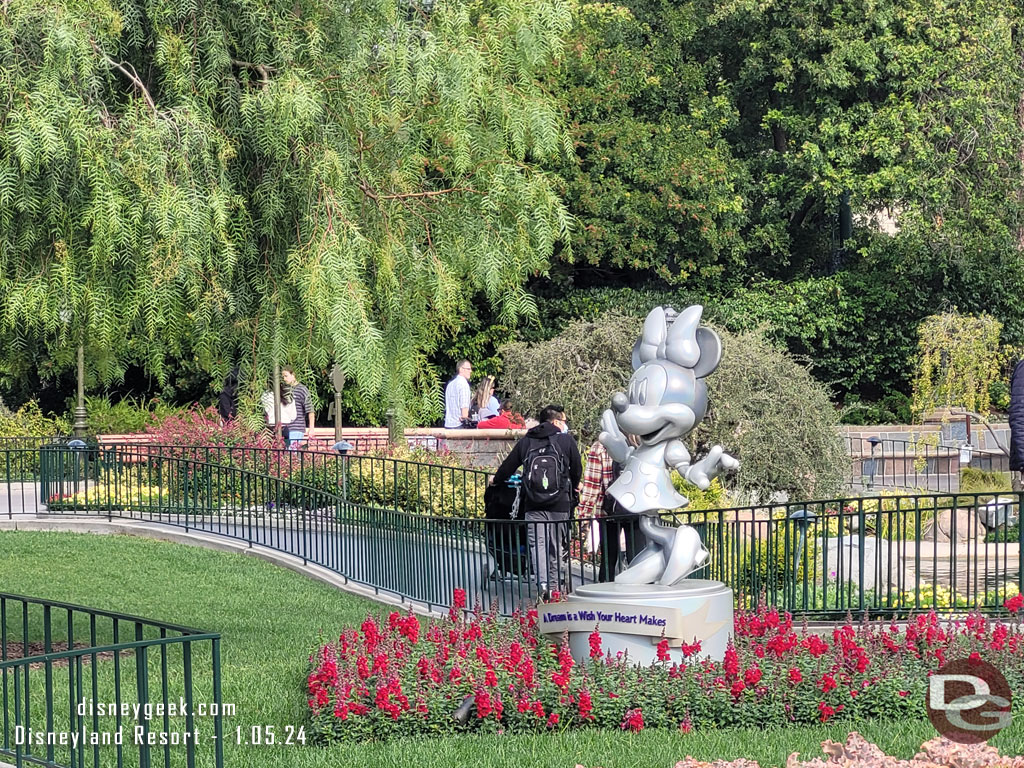 The Disney100 Minnie Mouse statue is in the hub, all other signs of the celebration appear to be gone.