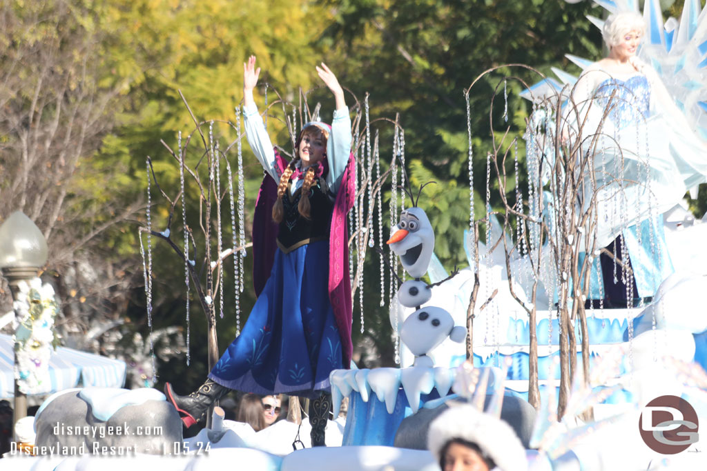 Anna and Olaf with Elsa in the background