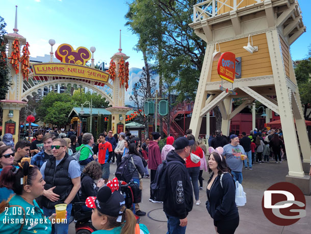 The return queue for Goofy's sky school was out into the parade route