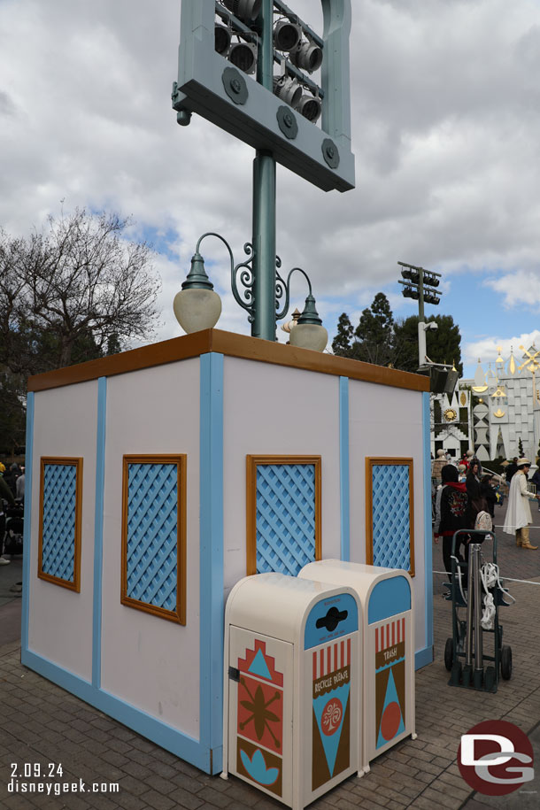 Renovation walls up around this post near it's a small world