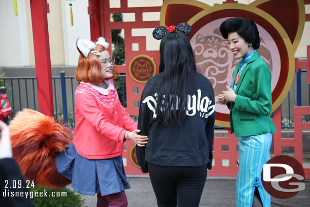 Mei and her mother greeting guests