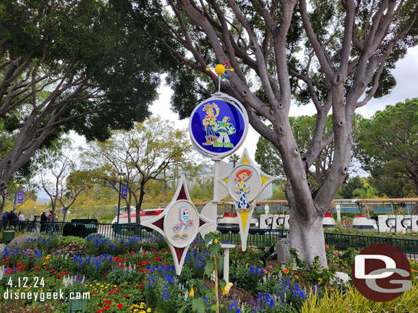 Another Pixar Fest display near the fountain and the tram stops.