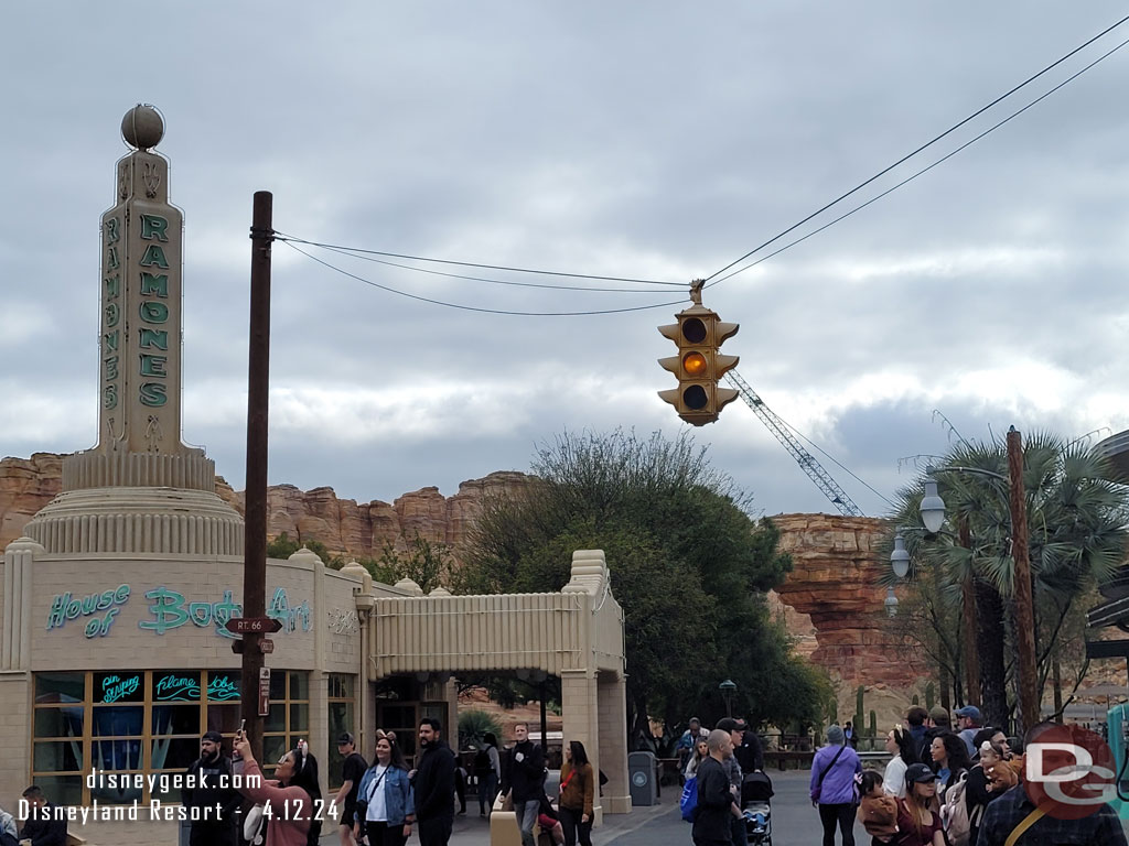 A large crane backstage beyond Cars Land