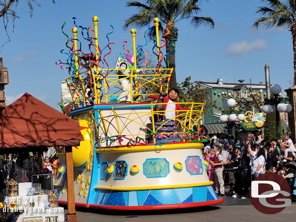 Miguel from Coco and the Toy Story gang on the front and top of the float