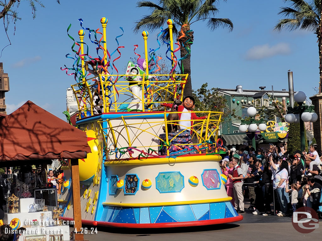 Miguel from Coco and the Toy Story gang on the front and top of the float