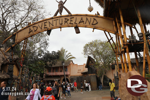 The first set of walls are gone in Adventureland.  The set nearest the restrooms is still there.