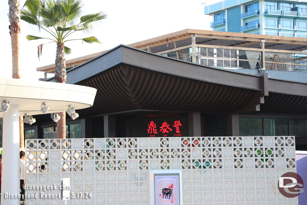 Din Tai Fung looks like it will be opening soon. The signs are installed and were on today.  Also some of the walls have been replaced with fences on the lawn side