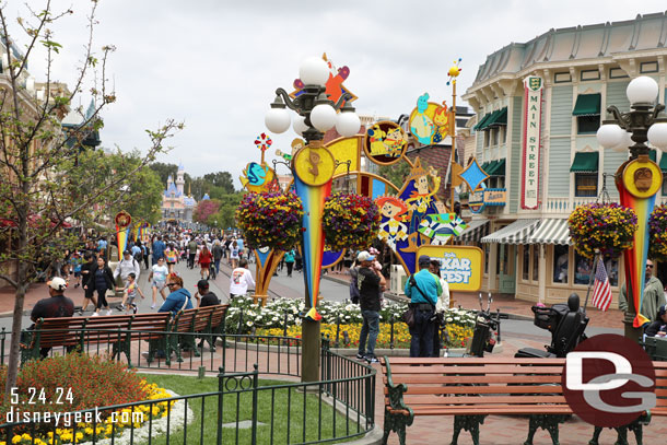 Benches block the paths so PhotoPass can take pictures with the Pixar Fest sculpture.