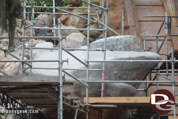 This section of rock work is moving along. The first layer of concrete is being applied to some of it.