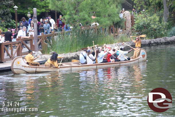 A canoe setting off only half full.  Not sure if this was a training exercise or what.