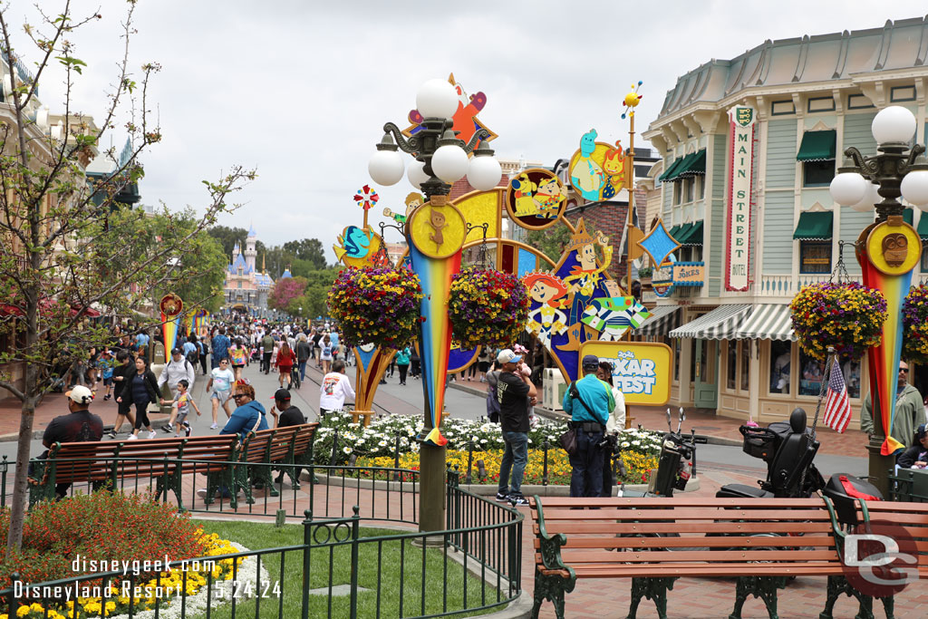 Benches block the paths so PhotoPass can take pictures with the Pixar Fest sculpture.