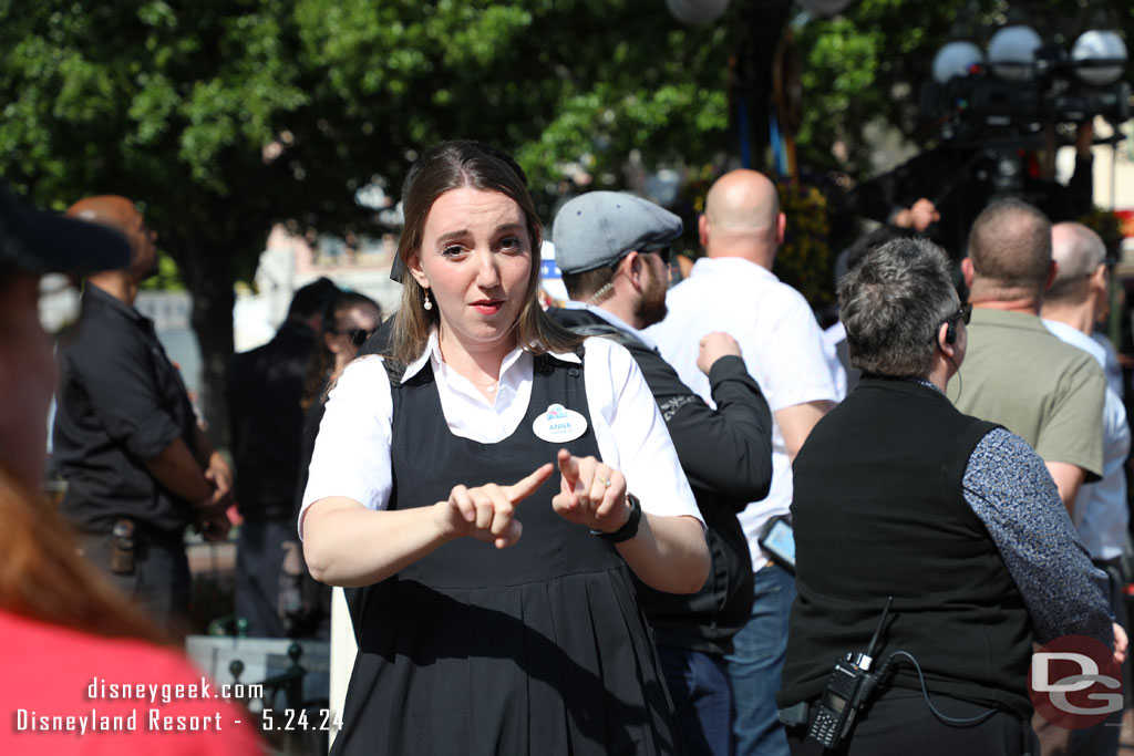 A cast member signing near by.