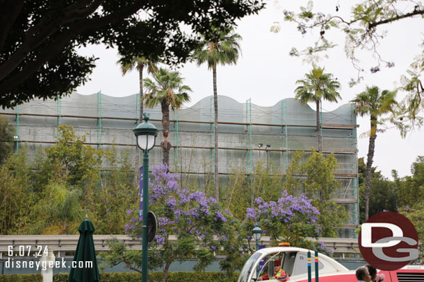 12:13pm - Renovation work continues on the exterior of the Indiana Jones Adventure show building.