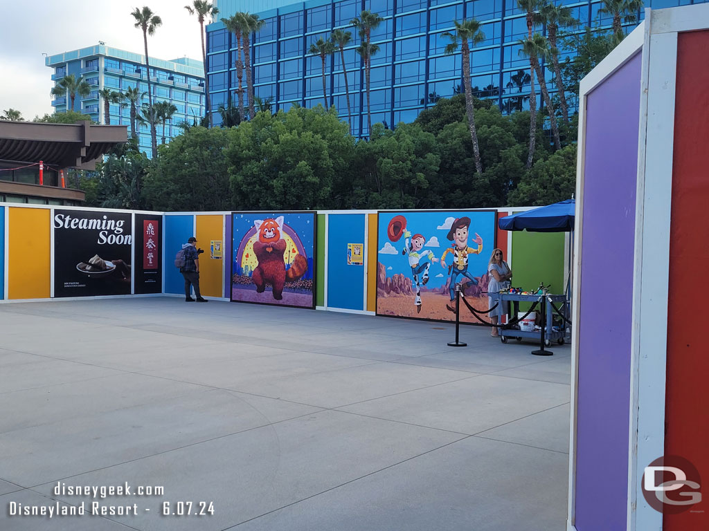 The walkway to the Disneyland Hotel is walled off the security checkpoint removed.  There is a new one to the south past the lawn.  The construction walls feature Pixar Fest artwork.