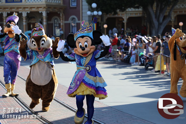 Minnie Mouse and the gang following the lead float