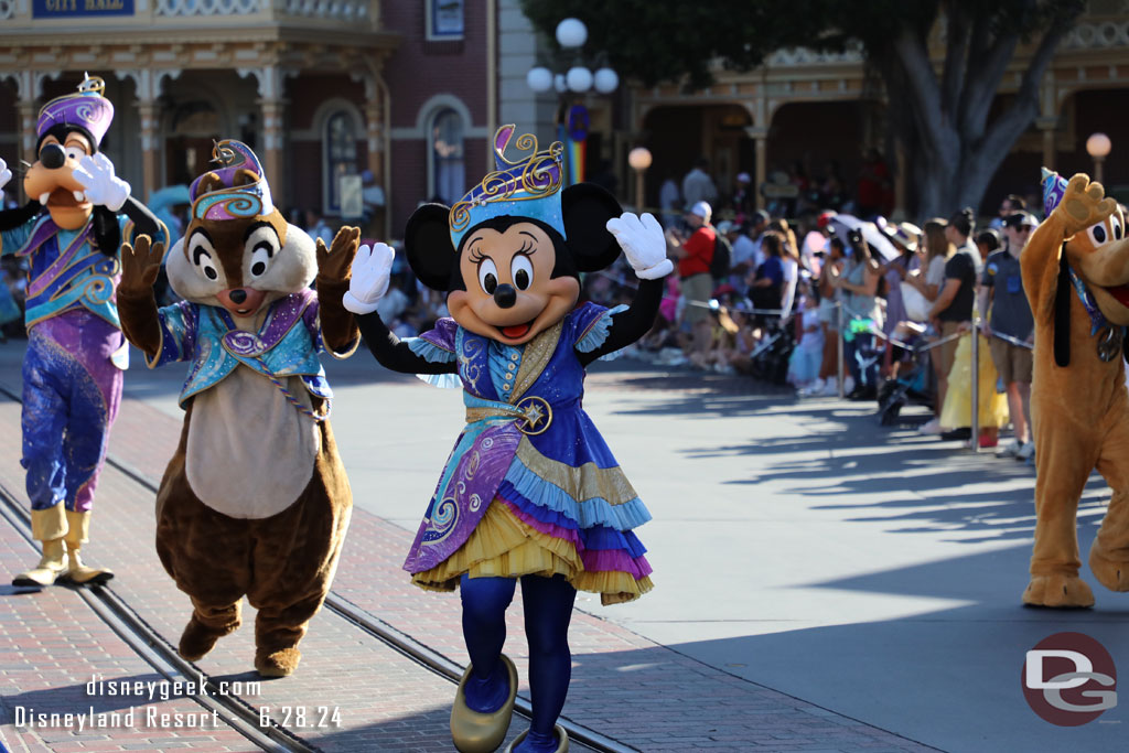 Minnie Mouse and the gang following the lead float