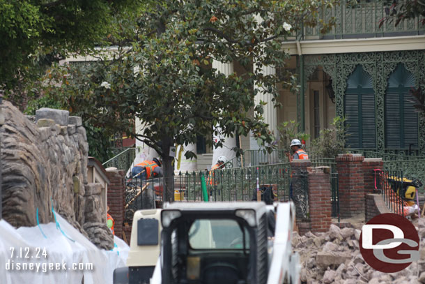 Another angle of the team working at the entrance to the Haunted Mansion