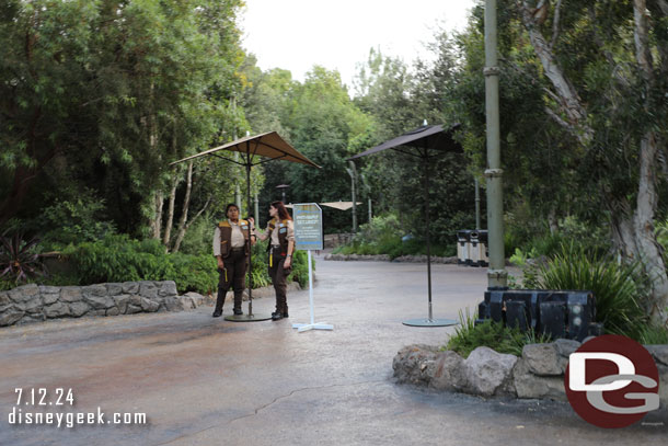 More signs and cast members warning of the closed path and turning guests around.