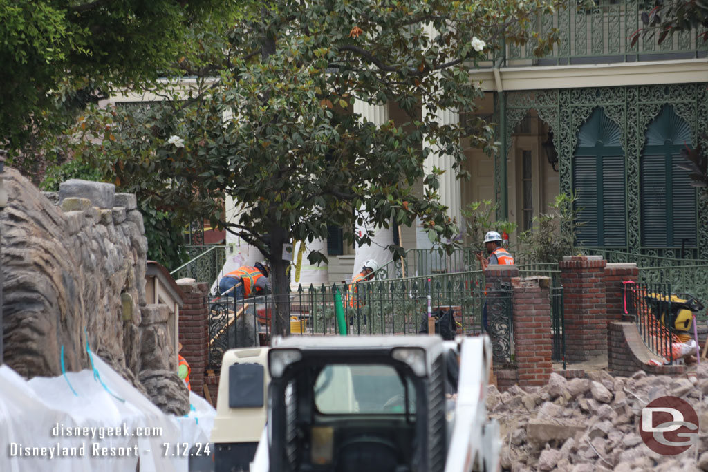 Another angle of the team working at the entrance to the Haunted Mansion