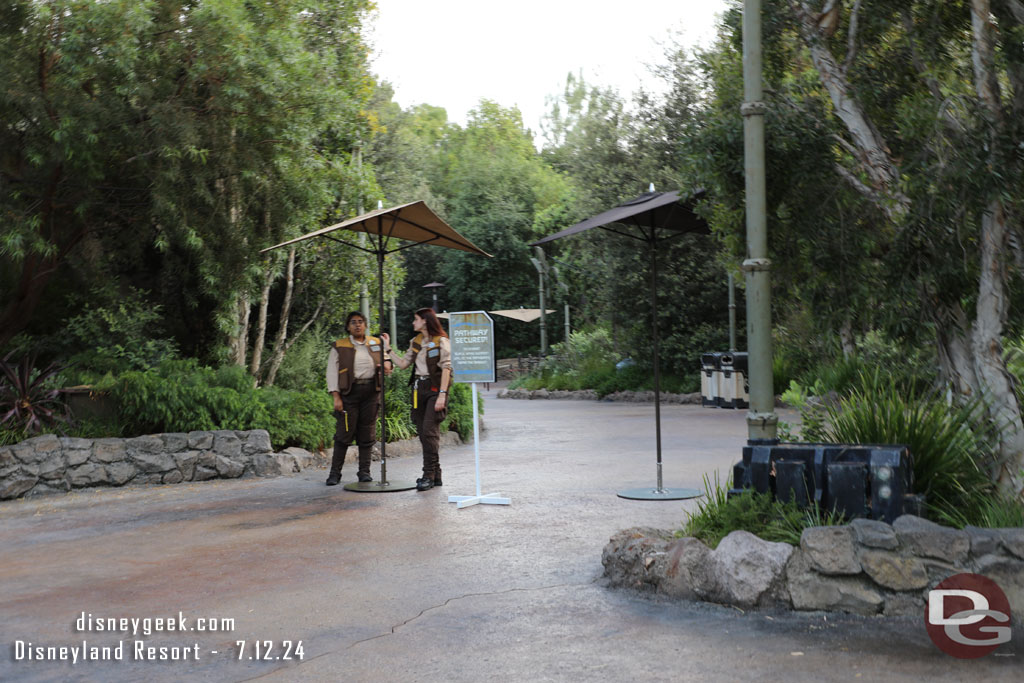 More signs and cast members warning of the closed path and turning guests around.